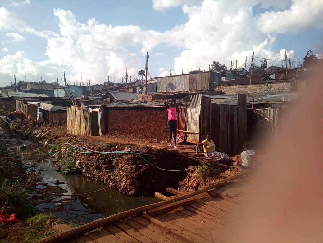 Community homes beside an open drainage channel