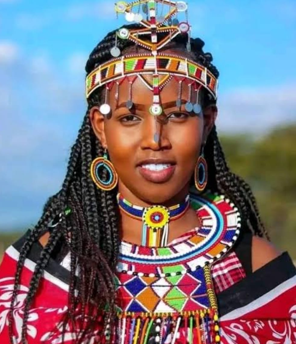 A young woman in traditional beadwork representing single mothers we walk with